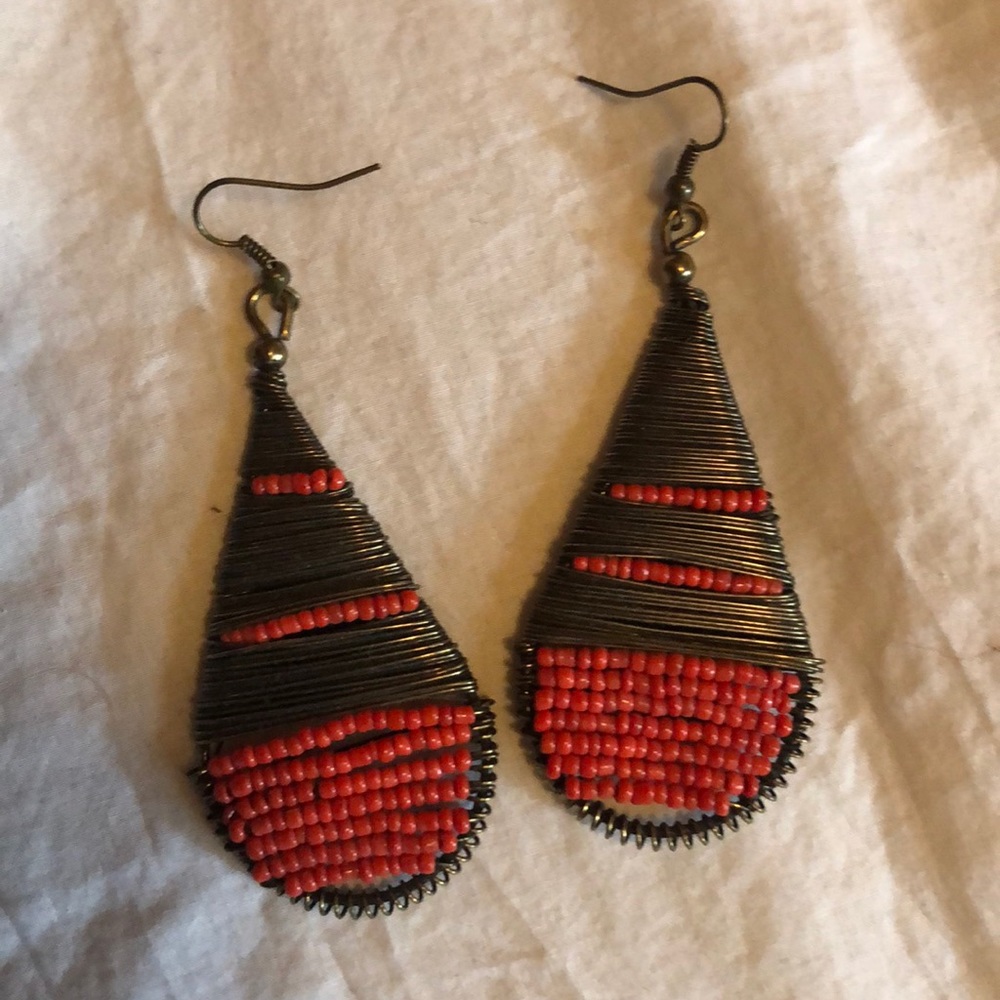 Orange and copper tear drop dangly earrings.